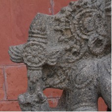 Statue of an Indian god, cross with solar disc